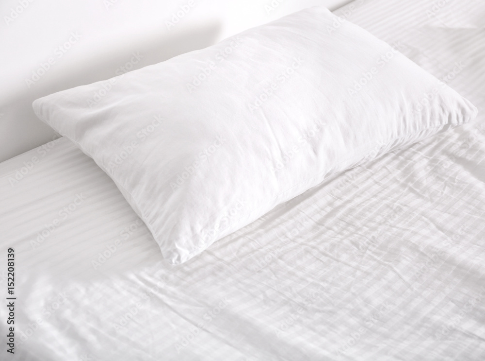 White orthopedic pillow on bed White orthopedic pillow on bed
