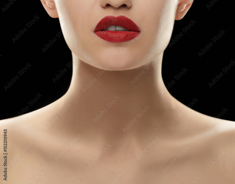 Beautiful young woman on dark background, closeup Beautiful young woman on dark background, closeup
