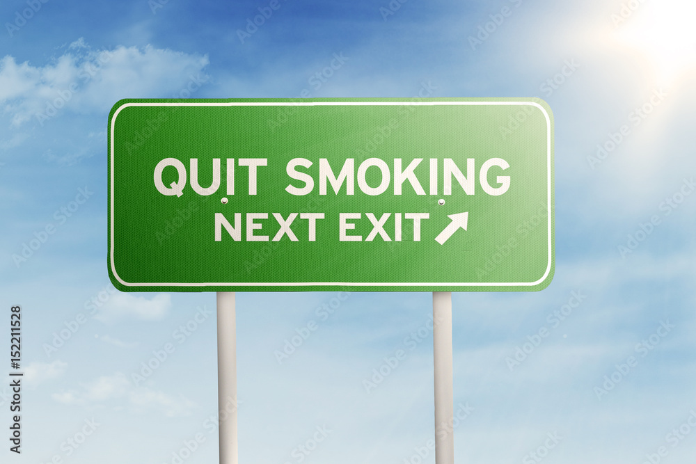 Green road sign with text of quit smoking Green road sign with text of quit smoking