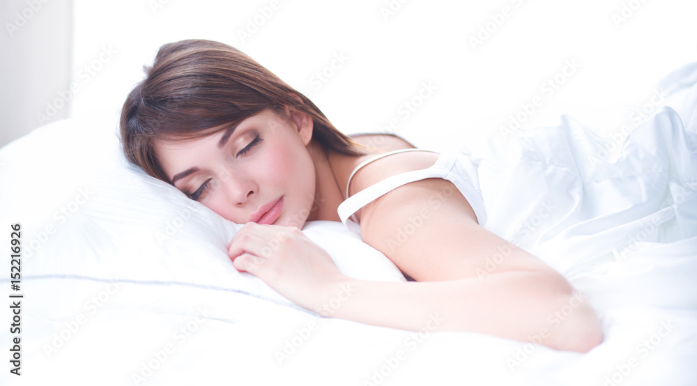 Beautiful girl sleeps in the bedroom, lying on bed Beautiful girl sleeps in the bedroom, lying on bed