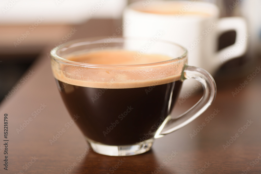 Cup of coffee on wooden table Cup of coffee on wooden table