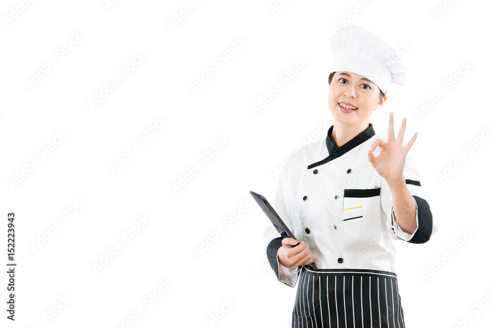 cook holding tablet pad and okay gesture cook holding tablet pad and okay gesture