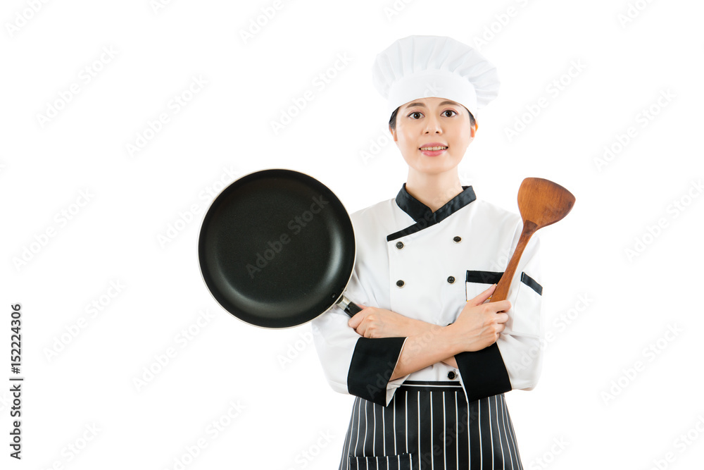 professional chef showing pan and wooden spatula professional chef showing pan and wooden spatula