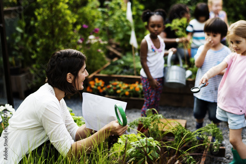 Teacher and kids school learning ecology gardening