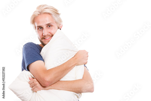 Man playing with pillows, good sleep concept