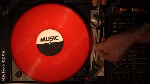 Top view of turntable and vinyl record. looking a vinyl and record player from above. Flat lay background. photo