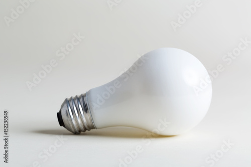 Colored lightbulb on a white background