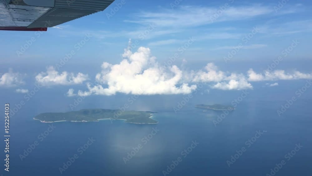 aerial view from aircraft over tropical blue sea with blue sky and cloud at Koh Lan islands, Pattaya aerial view from aircraft over tropical blue sea with blue sky and cloud at Koh Lan islands, Pattaya