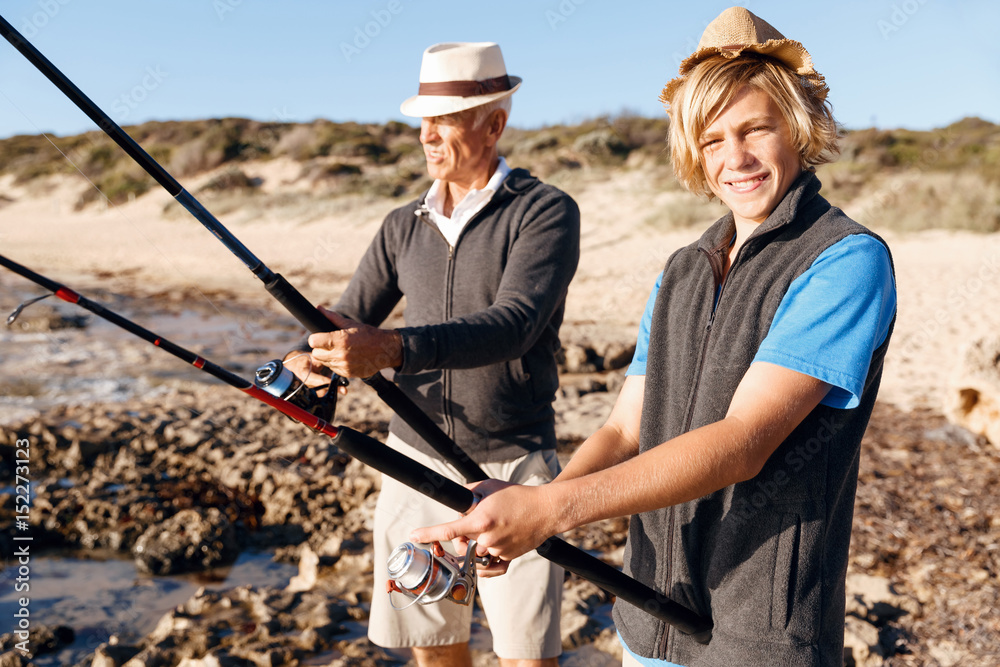 Senior man fishing with his grandson Senior man fishing with his grandson