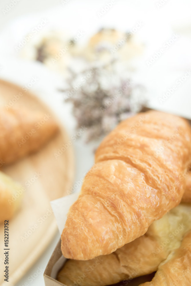 croissants on brown white table.