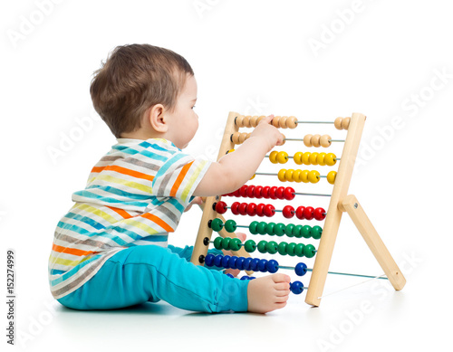 Baby playing with abacus. I...