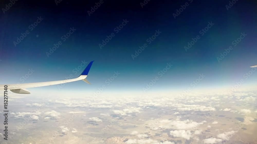 traveling over clouds in an airplane traveling over clouds in an airplane