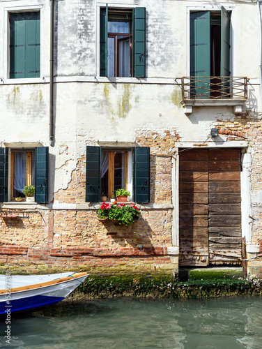 facade of the house along the canal of Venice, Italy © Georgia K