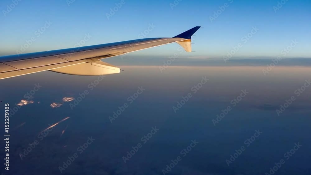 traveling over clouds in an airplane traveling over clouds in an airplane