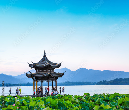 ancient pavilion of Hangzhou west lake at dusk, in China