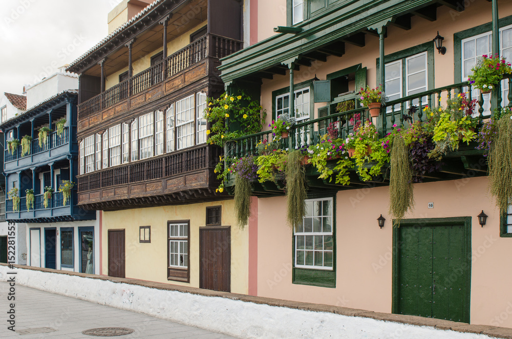 Famous ancient colorful balconies decorated with flowers in Santa Cruz de La Palma.