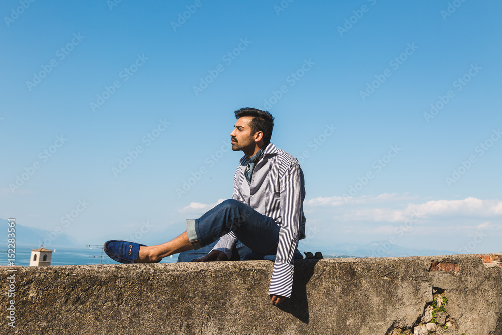 Handsome man posing in a vacation context Handsome man posing in a vacation context