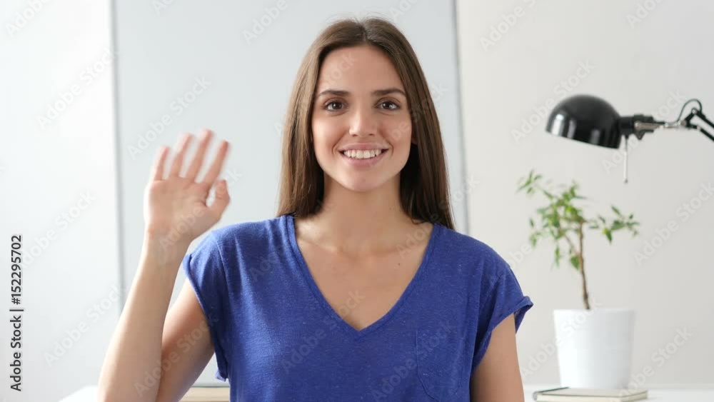 Beautiful Woman Waving Hand to Welcome Beautiful Woman Waving Hand to Welcome