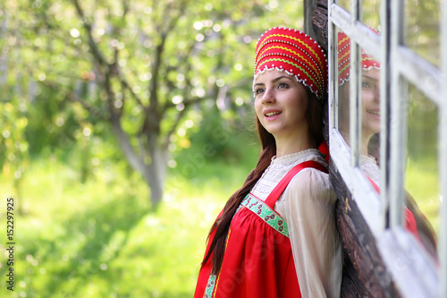 Slav woman in traditional dress wooden wall