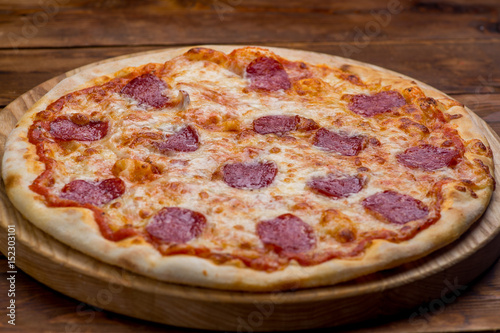 Pizza on a wooden background