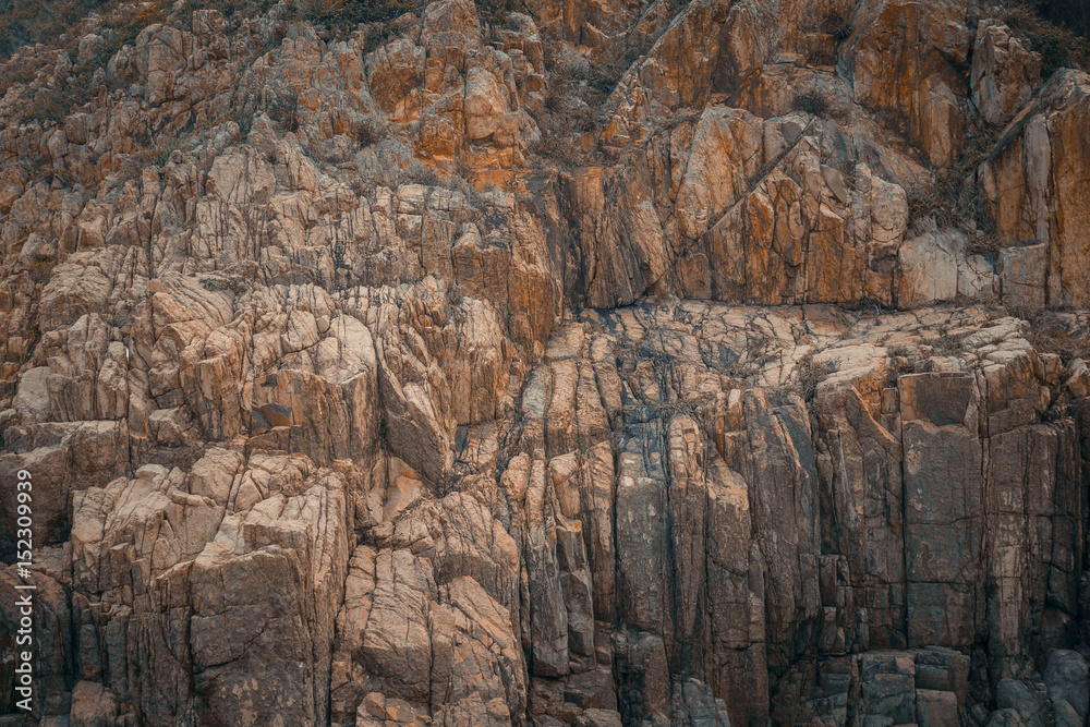 Stone mountain cliff texture background.