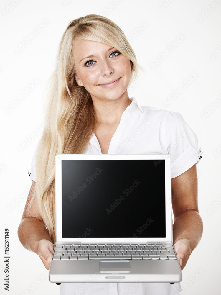 Woman presenting her laptop with copyspace Woman presenting her laptop with copyspace