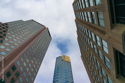 Looking up at modern skyscrapers photo