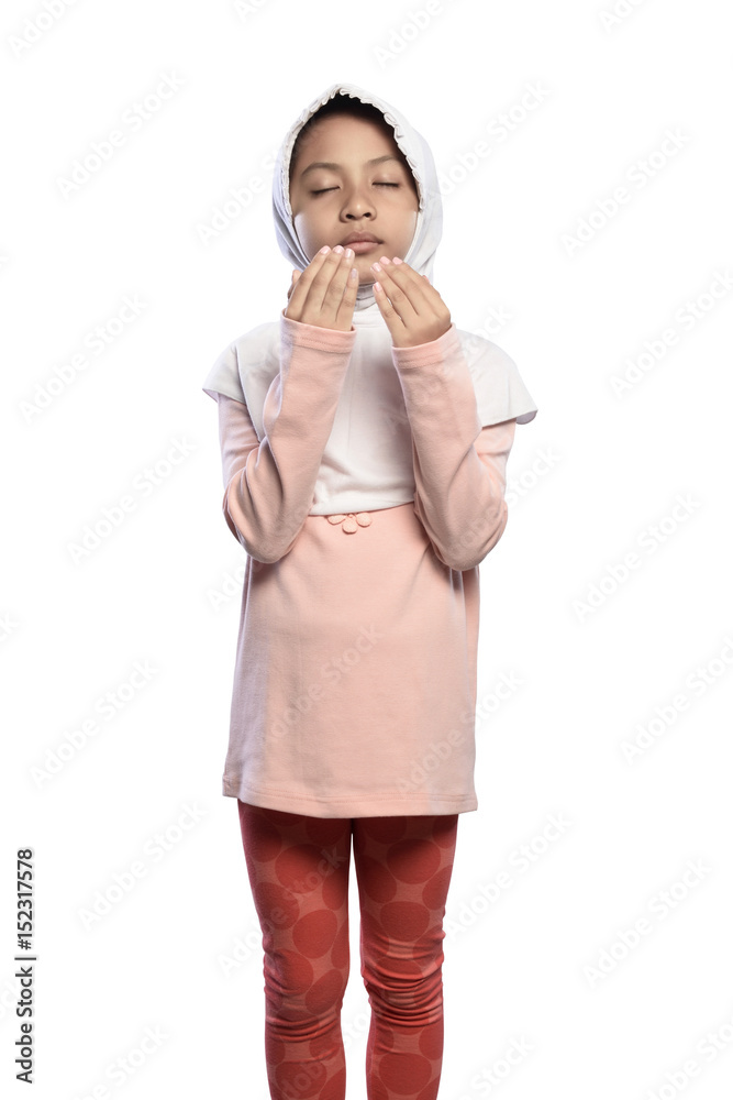 Little asian muslim girl wearing veil praying to god Little asian muslim girl wearing veil praying to god