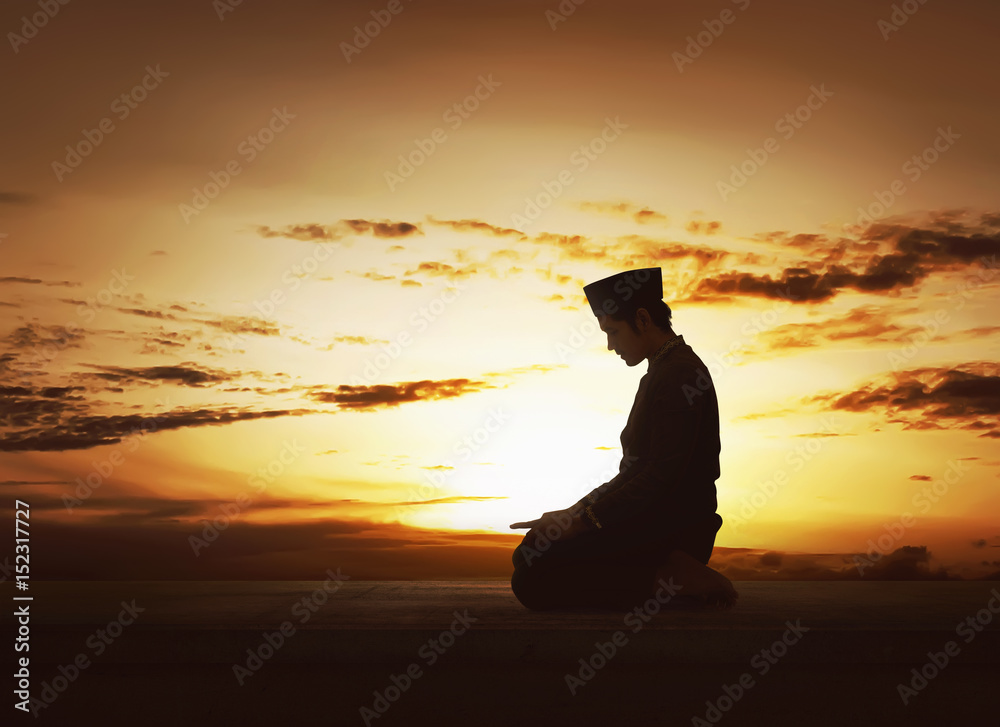 Young asian muslim man worshiped praying to god