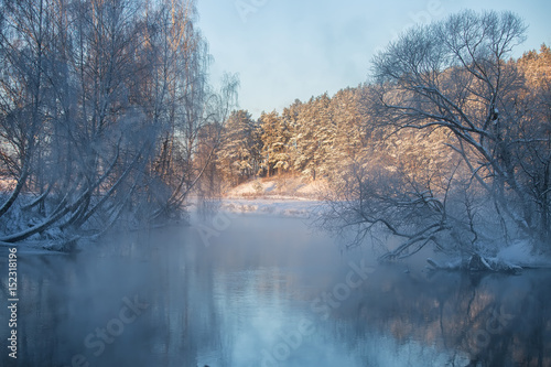 Winter landscape misty dawn on the winter river