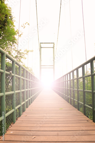 Fototapeta Naklejka Na Ścianę i Meble -  Rope bridge wood floor, Sweetheart on the steel bridge with blurred style