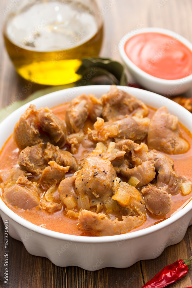 boiled chicken gizzards  with vegetables on white bowl