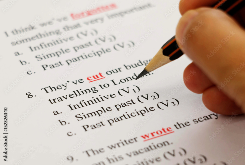 english exam on table with pencil english exam on table with pencil