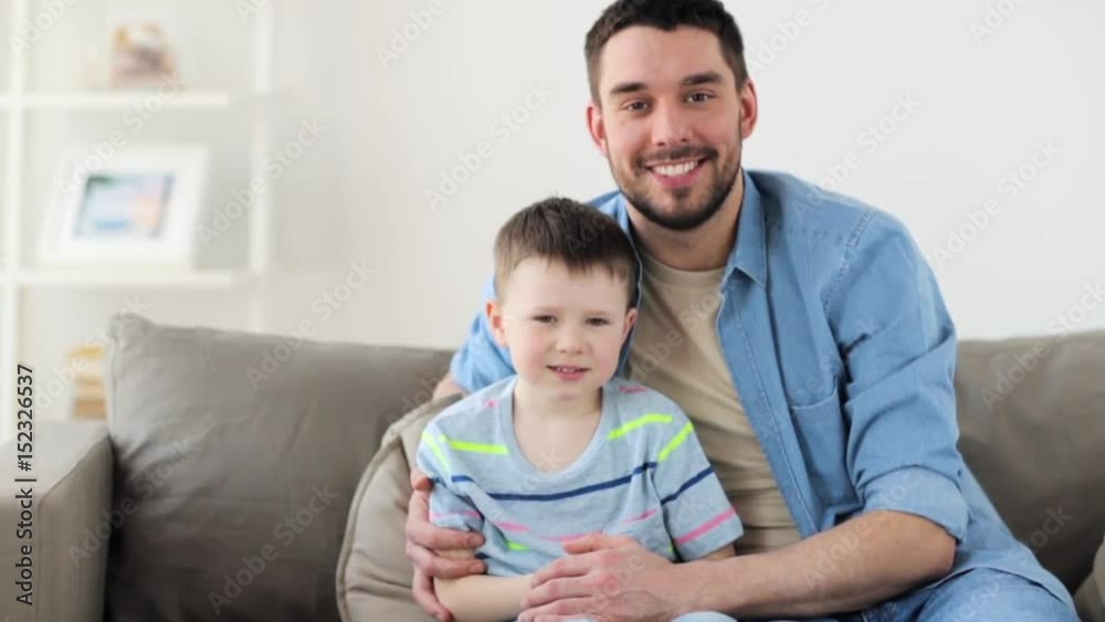 happy father and little son hugging at home happy father and little son hugging at home