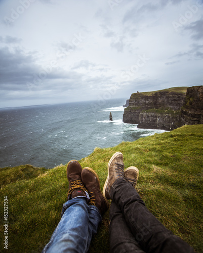 A beautiful feet selfie at the coast of Atlantic ocean in Ireland. photo