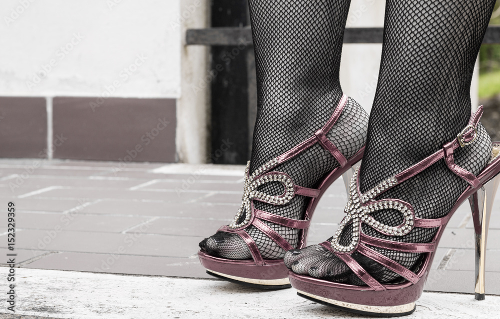 Sexy legs in fishnet stockings and red high heels Stock Photo | Adobe Stock