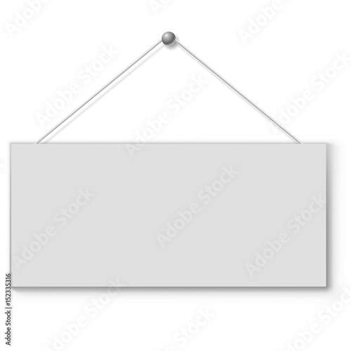 Blank white door plate hanging on the string. photo