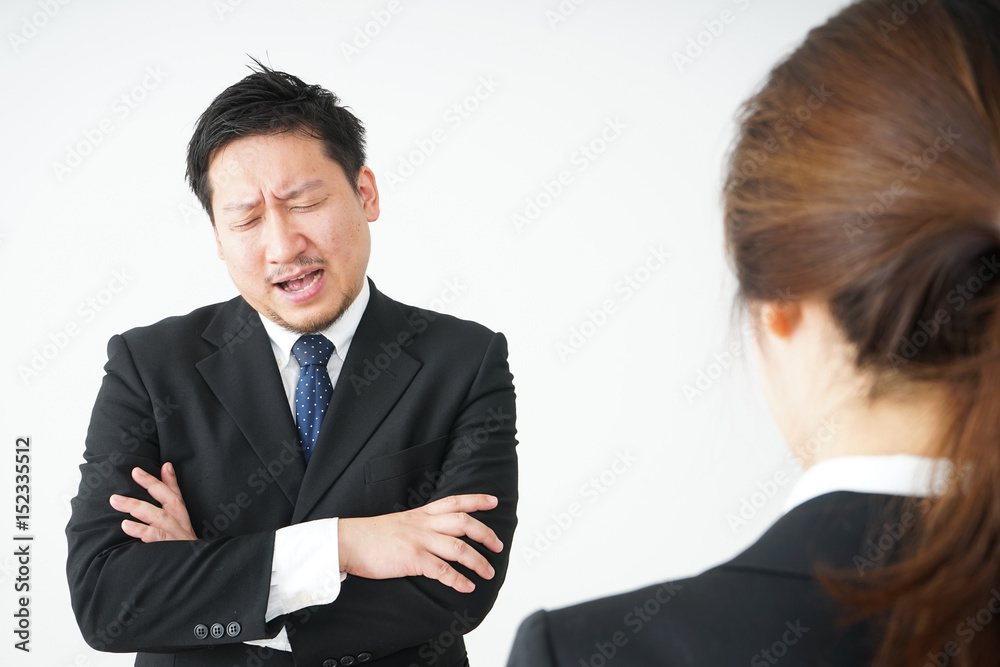Boss angry with young business person Boss angry with young business person