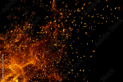 Flame of fire with sparks on a black background