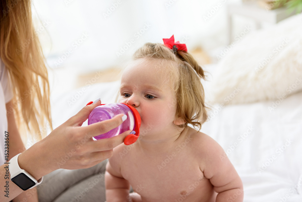 Pretty toddler is very thirsty Pretty toddler is very thirsty