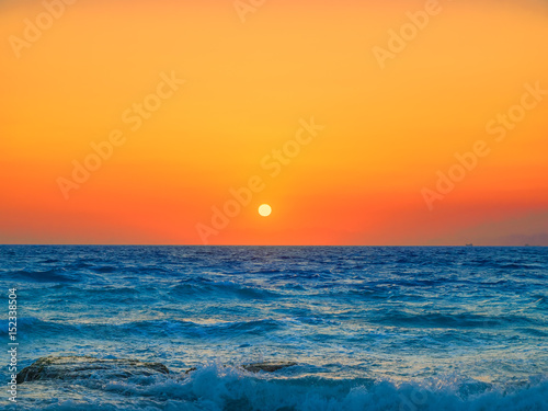 Fototapeta Naklejka Na Ścianę i Meble -  Mediterranean sea orange sunset background.