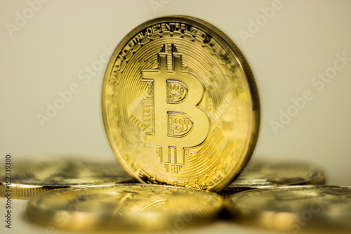 Photo Of Golden Bitcoin virtual currency coin. photo