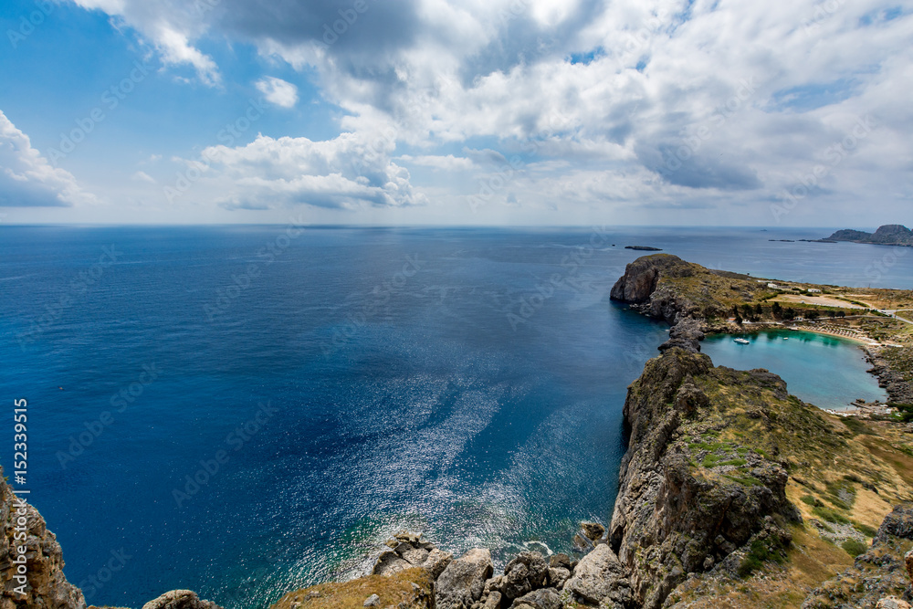 View of St Paul's Bay on a cloudy day, view from the Lindos castle, Rhodes island, Greece