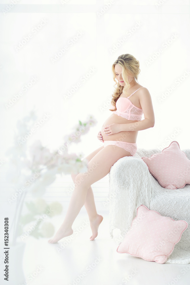pregnant woman indoors. pregnant naked belly pregnant woman indoors. pregnant naked belly