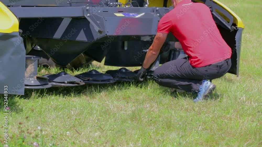 custom made wallpaper toronto digitalA young man is trying to open something on the lower part of the agricultural machinery because he needs to fix something.