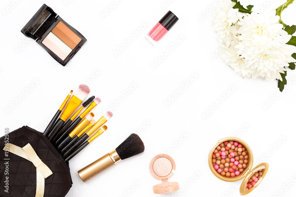 chrysanthemum flower, brushes, eye shadow and other makeup accessories on white background. The concept of beauty. Top view. chrysanthemum flower, brushes, eye shadow and other makeup accessories on white background. The concept of beauty. Top view.