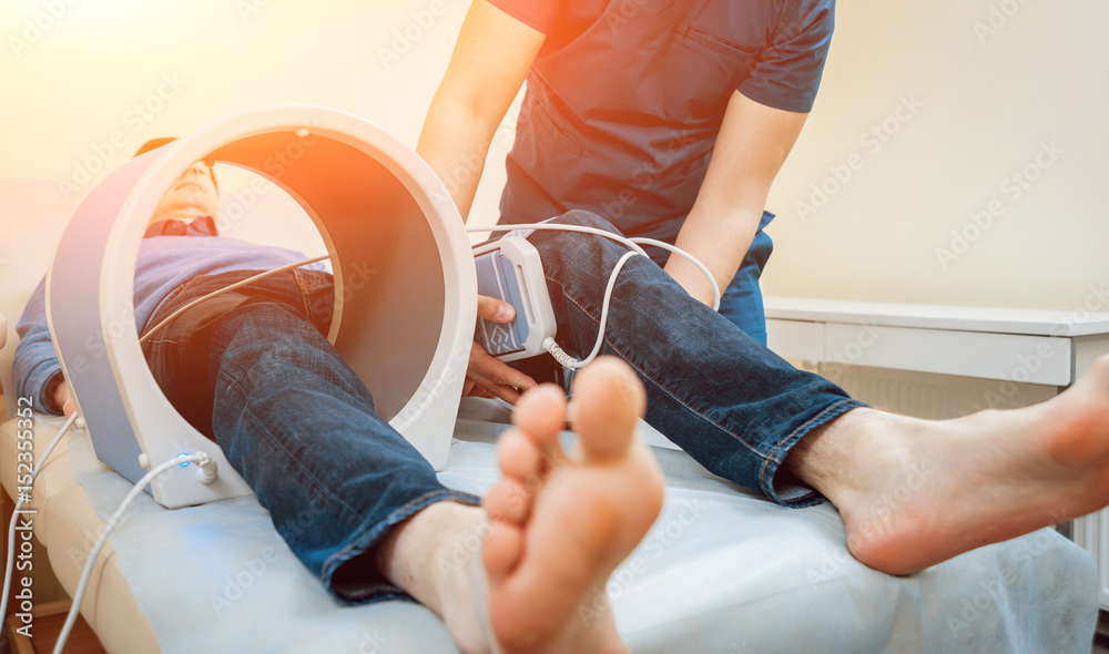 therapy system. Patient with doctor in office. Stock Photo Adobe Stock