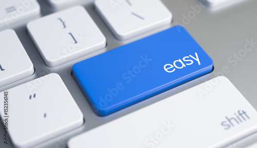 Easy Written on Blue Key of Metallic Keyboard. High Quality Render of a Modern Keyboard Button. The Button is Blue in Color and there is Caption Easy on It. 3D Render. photo
