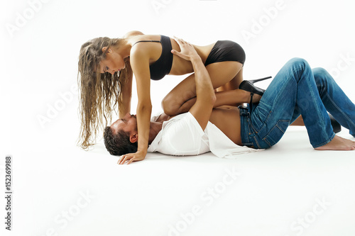 Sexy girl and handsome man lying on floor