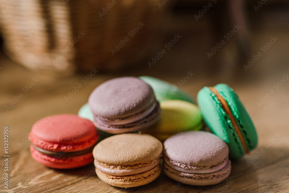 vivid color macaroons on wooden table